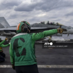 In this handout photo released by the US Navy on January 31, 2026, an F/A-18F Super Hornet attached to Strike Fighter Squadron (VFA) 41 prepares to launch from the flight deck of the Nimitz-class aircraft carrier USS Abraham Lincoln (CVN-72) as it conducts routine flight operations in the Arabian Sea on January 28, 2026.