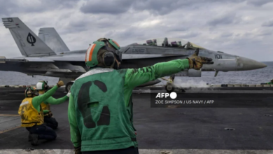 In this handout photo released by the US Navy on January 31, 2026, an F/A-18F Super Hornet attached to Strike Fighter Squadron (VFA) 41 prepares to launch from the flight deck of the Nimitz-class aircraft carrier USS Abraham Lincoln (CVN-72) as it conducts routine flight operations in the Arabian Sea on January 28, 2026.